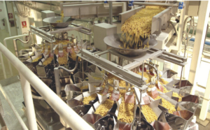 an image showing production of potato chips in a factory