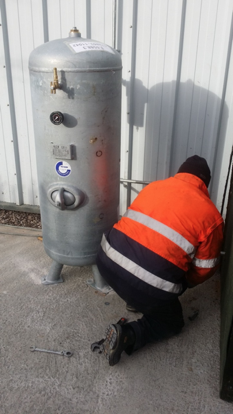 Glaston engineer installing air compressor system